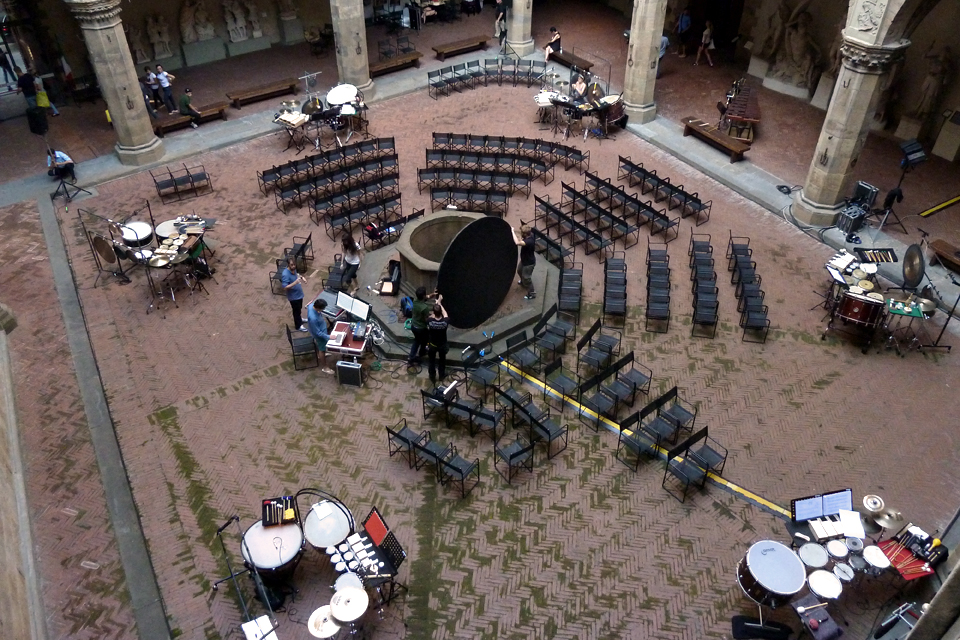 Birds-eye view of chairs and percussion in an outdoor venue in Florence, Italy